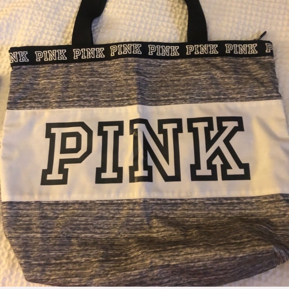 Pink large tote with a zipper in the middle.